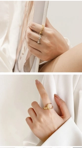 Detail of 18K gold plated and silver stainless steel rings with irregular beaded texture