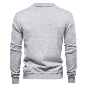 Rear view of a light gray long-sleeve knit sweater with ribbed cuffs and hem details