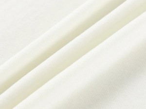 Close-up of white tencel wool fabric texture showing high-quality knit grain and weave