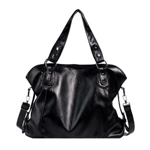 Large black faux leather tote bag with silver hardware and adjustable shoulder strap