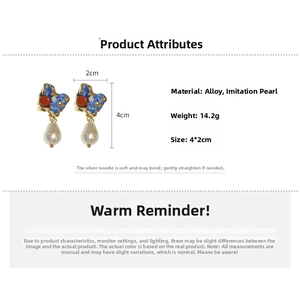 Detail view of vintage enamel irregular pearl earrings with size dimensions 4x2cm