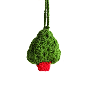Handmade crochet Christmas tree ornament with green yarn and red base for festive decoration
