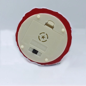 Detail of the base featuring a battery compartment, power switch, and non-slip pads