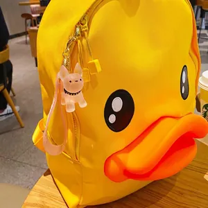 Cute yellow duck backpack with a transparent French Bulldog charm and cartoon details