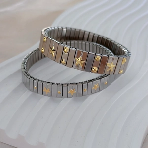 Polished stainless steel elastic bracelet with gold star and dot relief pattern