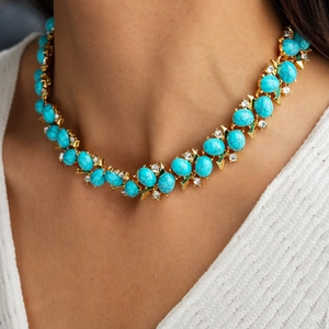 Detail of vintage double-layer necklace with turquoise resin and sparkling zircon stones