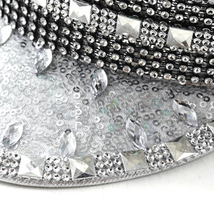 Detailed macro view of sparkling sequins and silver rhinestones on a stylish leopard party hat