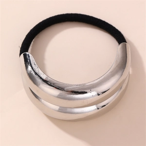 Detail of silver double-layered metal buckle on a black elastic hair tie minimalist style