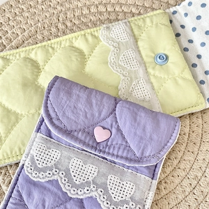 Detailed view of quilted heart pattern and lace trim on soft fabric glasses pouches