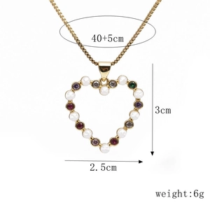Detailed view of heart pendant with pearls and colorful stones showing 3cm height dimensions