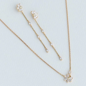 Elegant 14K gold plated flower necklace and tassel earring set with green zircon stones