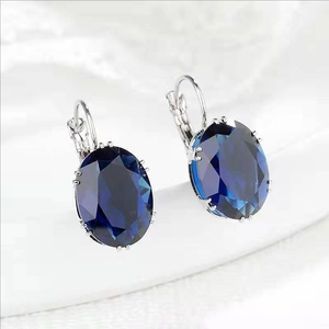 Elegant oval dark blue gemstone earrings with silver lever-back hooks for women