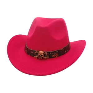 Detail of rose pink felt cowboy hat with vintage bronze skull buckle on dark brown band