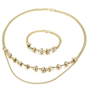 Double-layered gold stainless steel necklace and bracelet set with knot elements on white