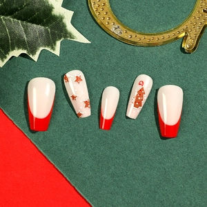 Christmas press-on nails set featuring red French tips and star patterns with a tree