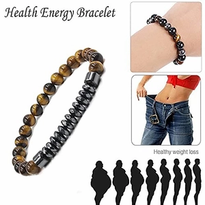 Detail of 6mm tiger eye and hematite beaded bracelets showing slimming health benefits