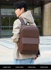 Close-up of deep brown lychee texture on large capacity business travel backpack