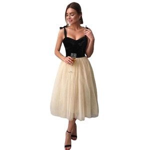 Elegant black velvet and beige tulle evening gown with bow straps in Hepburn style