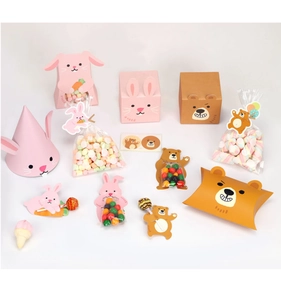 Detail of colorful cartoon bunny and bear paper candy boxes for party gift packaging