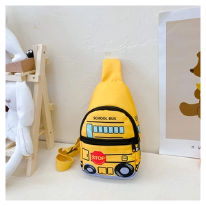 Detail view of cartoon school bus chest bag for kids in vibrant yellow waterproof fabric