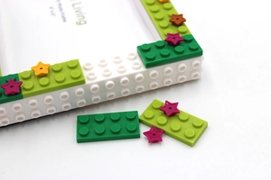 Detail of 4x6 DIY building block photo frame with colorful stars and blocks decoration