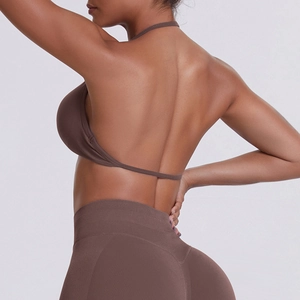 Detail view of the brown seamless backless sports bra and high-waist yoga leggings