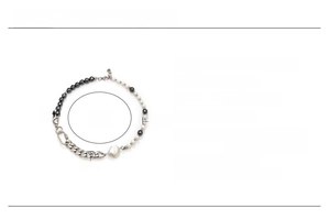 Detailed view of pearl and black stone necklace with chain dimensions and material specs
