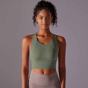 Women's dark green yoga sports bra and lilac high-waisted leggings set for fitness