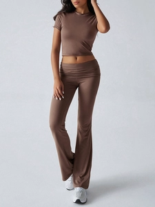 Brown two-piece casual set with short sleeve crop top and high-waisted flared pants