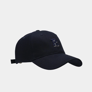 Close-up of a navy blue baseball cap featuring a detailed 3D embroidered letter R