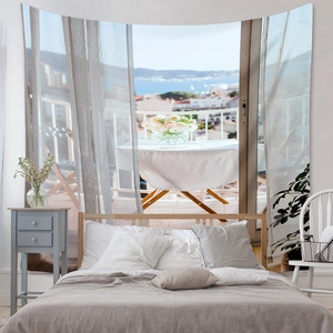 Detail of bohemian tapestry featuring a Mediterranean sea view balcony with flowers