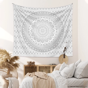 Detail of light gray mandala tapestry on white background in a minimalist bedroom decor