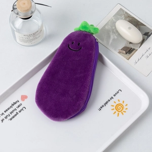 Detailed view of the cute purple eggplant plush pencil case with a smiling face embroidery