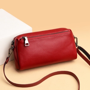 Chic red genuine leather shoulder bag with lychee texture and adjustable crossbody strap