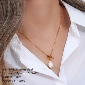 Detailed view of baroque pearl necklace with gold stainless steel OT buckle on a model