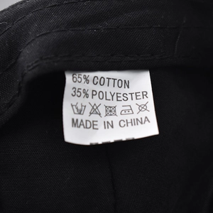 Detail of product care label showing 65% cotton and 35% polyester fabric blend