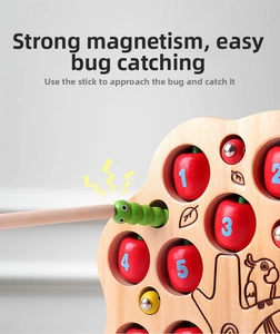 Macro view of magnetic catching stick lifting a wooden numbered apple from the puzzle base