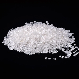 Natural clear white crystal gravel stones for aquarium decoration on black background