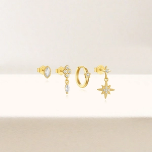 Detailed set of four S925 sterling silver gold earrings with marquise-cut stones and stars