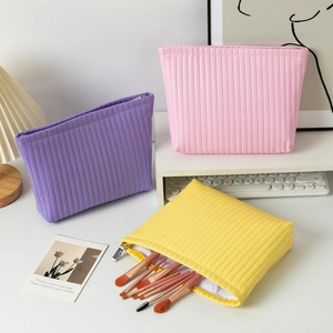 Waterproof quilted makeup bags in purple, pink and yellow with large capacity storage