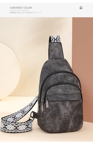 Detail view of multi-compartment gray canvas chest bag with tribal woven strap