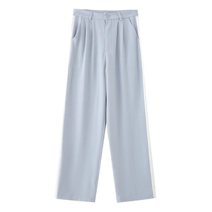 Detail of light blue women's casual trousers featuring a contrast white side stripe