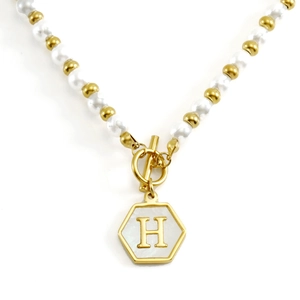18K gold plated pearl chain necklace with hexagonal initial H pendant on white background