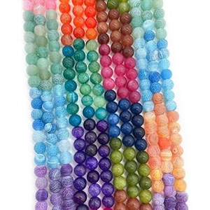 Macro view of colorful dragon vein agate round loose beads for DIY jewelry making