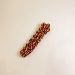Detailed close-up of multi-color woven cotton rope dog chew toy with spiral texture