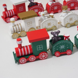 Detail view of colorful wooden Christmas train sets with festive bears and gift boxes
