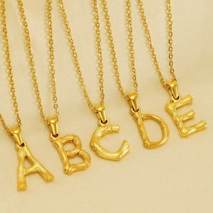 Golden stainless steel initial necklaces with A-E bamboo textured alphabet pendants