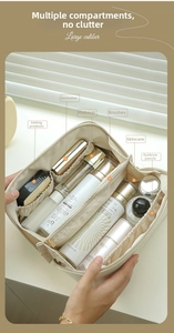 Macro shot of large capacity cream makeup bag with internal dividers for cosmetics storage