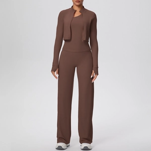 Detail view of brown rib-knit yoga set with zip jacket, vest, and wide-leg pants