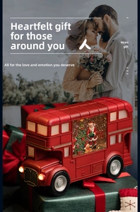 Classic red Christmas bus lantern with Santa Claus and sparkling snow swirl effect